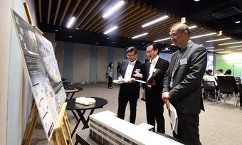 (From right) The Final Adjudication Panel, URA Non-Executive Director, Professor Tang Bo-sin, URA Managing Director, Ir Wai Chi-sing, and VTC Deputy Executive Director, Ir Dr Eric Liu, conduct assessment for the eight shortlisted entries.