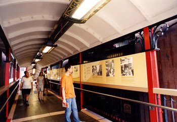 Display panels showing Sheung Wan's historical development attract attention. 	